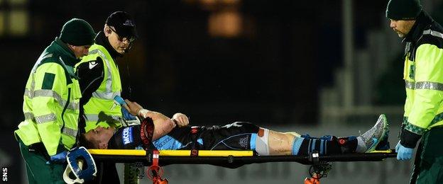 Former Glasgow full-back Glenn Bryce is taken off on a stretcher