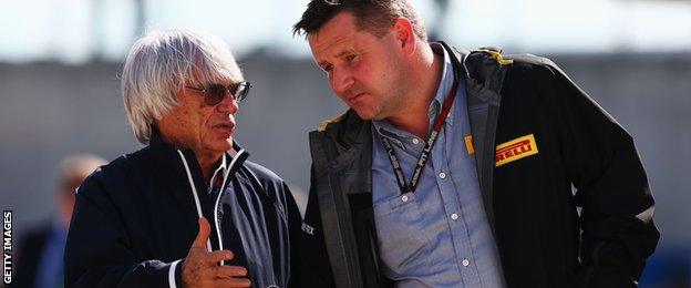 F1 supremo Bernie Ecclestone talks to Pirelli Motorsport director Paul Hembery