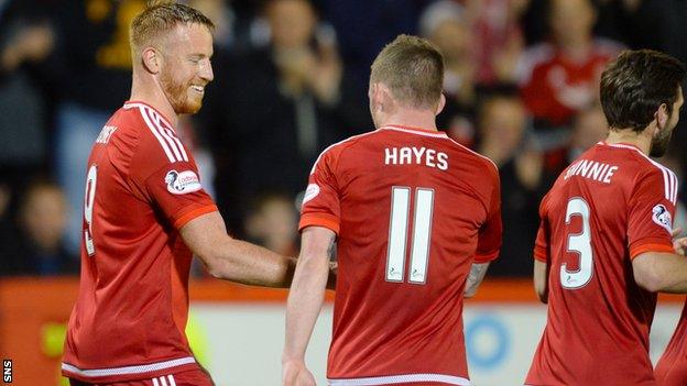 Adam Rooney (left) put Aberdeen in front from the penalty spot