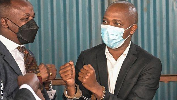 Football Kenya Federation president Nick Mwendwa (right) in handcuffs on 12 November