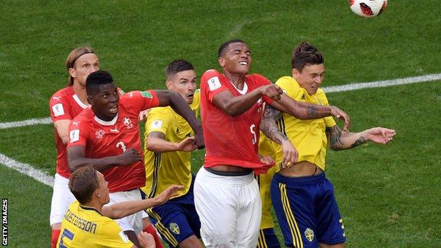 Switzerland battle against Sweden in the World Cup last-16 match