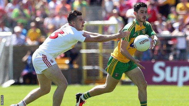 Connor McAliskey challenges Ryan McHugh for possession during the first half