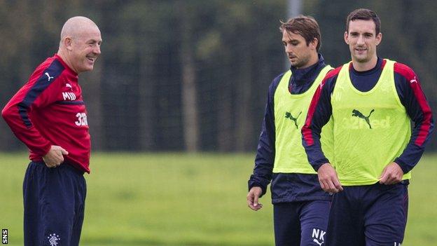 Mark Warburton in training with some of the Rangers players