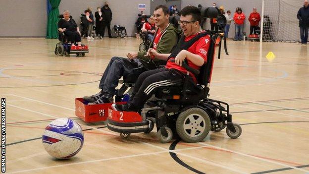 Members of Wrexham's powerchair football team in action