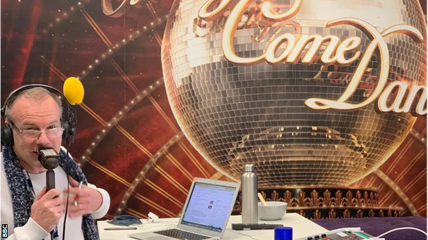 Simon Mann commentates in a Strictly Come Dancing-themed room at MediaCity in Salford