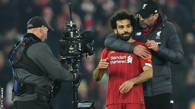 Jurgen Klopp hugs Mo Salah at the final whistle