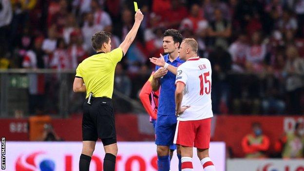 England's Harry Maguire and Poland's Kamil Glik were booked before half time