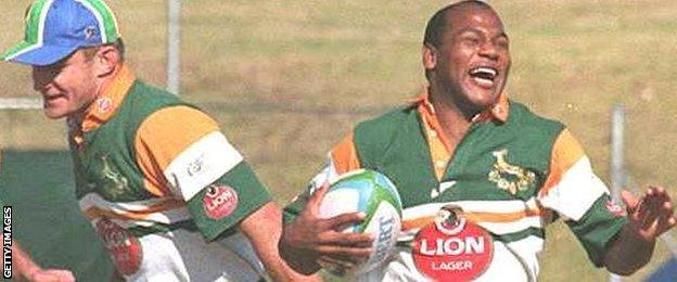 Chester Williams (right) shares a joke with captain Francois Pienaar during the 1995 World Cup