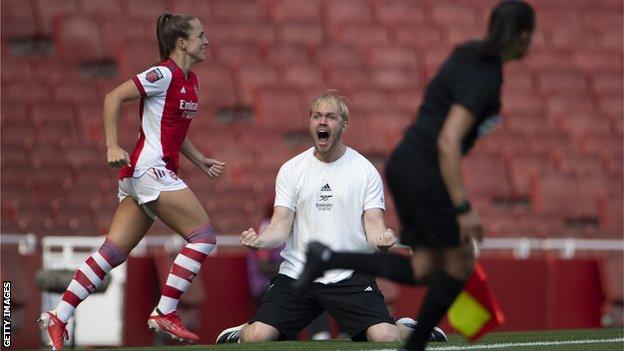 Jonas Eidevall on his knees, screaming in celebration