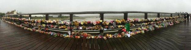 Floral tributes on the bridge close to the crash site