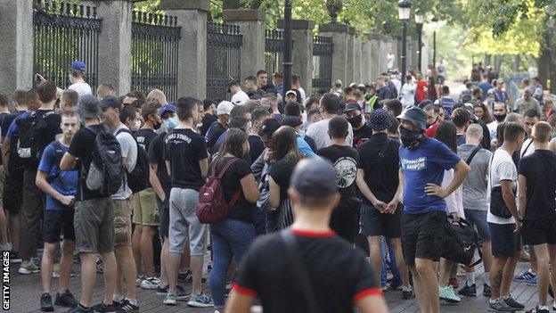 Dynamo Kyiv fans gather outside the club's stadium to state their opposition to Lucescu's appointment