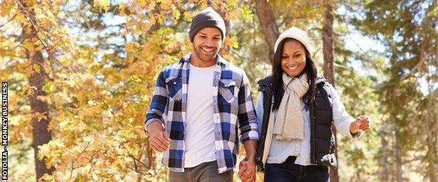 a woman and man on a hike smiling