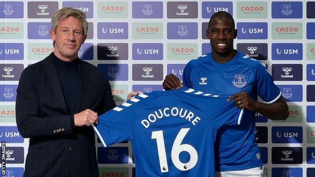 Everton's director of football Marcel Brands with new signing Abdoulaye Doucoure