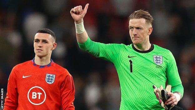 Phil Foden and Jordan Pickford