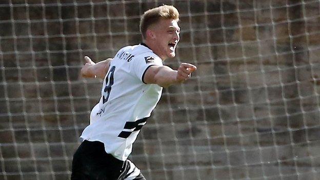 Luke Armstrong celebrates scoring a goal for Gateshead