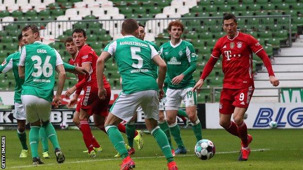 Robert Lewandowski (right) scores