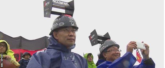 Fans with McLaren spoiler hats