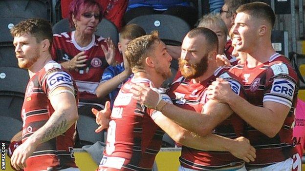 Jake Bibby celebrates his try