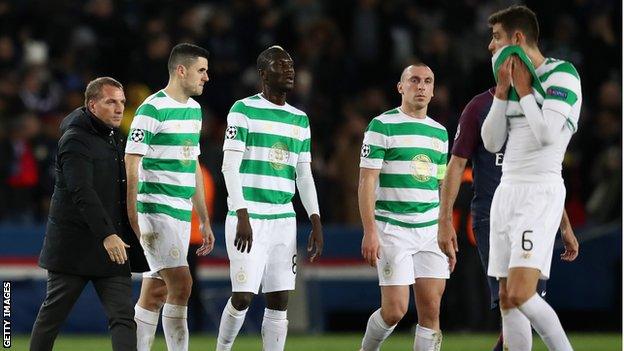 Celtic manager Brendan Rodgers on the pitch with his players after the final whistle.