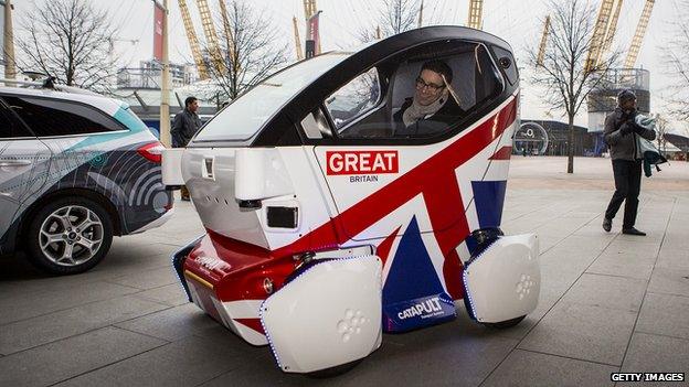 A driverless vehicle known as a Lutz 'Pathfinder' Pod during a photocall in central London on 11 February, 2015