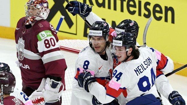 Great Britain celebrate scoring against Latvia