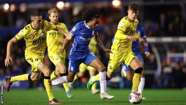 Birmingham's Tahith Chong tries to escape the attentions of three Millwall defenders