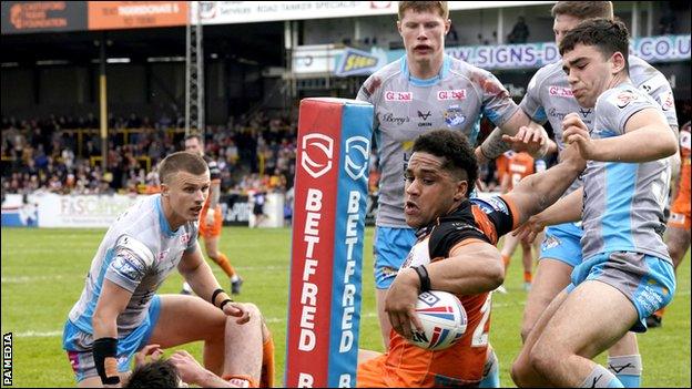 Leeds Rhinos' Jack Sinfield (right) failed to stop Castleford Tigers' Derrell Olpherts from scoring the hosts' second try