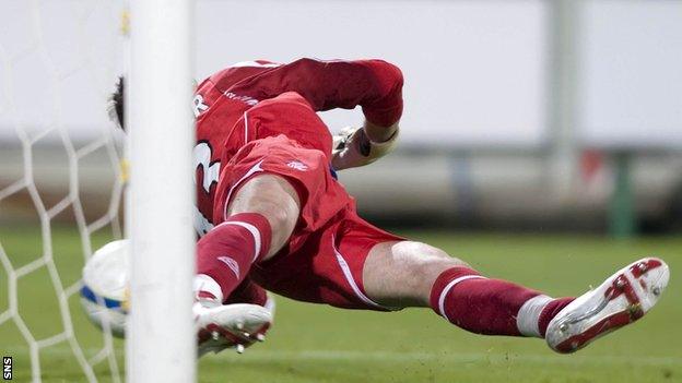 Rangers' stand-in goalkeeper Neil Alexander saves from Fabio Liverani in the shootout