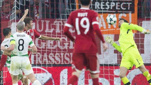 Craig Gordon saves a strong header from Thomas Muller