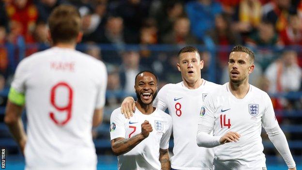 England players celebrate in Montenegro