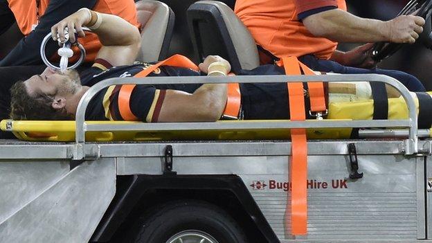 Leigh Halfpenny is transported from the pitch after suffering an injury