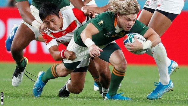 Faf de Klerk scores a try for South Africa against Japan