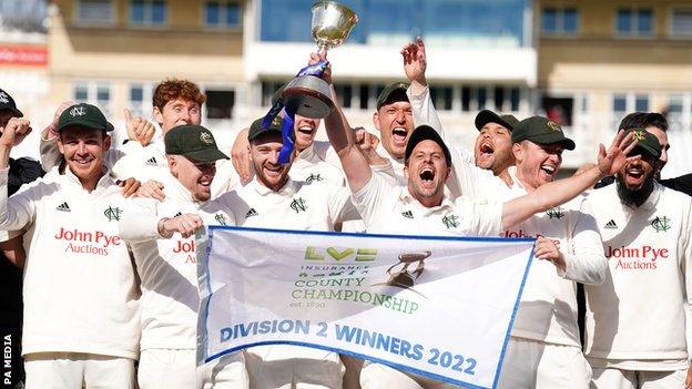 Notts players celebrate winning the Division Two title