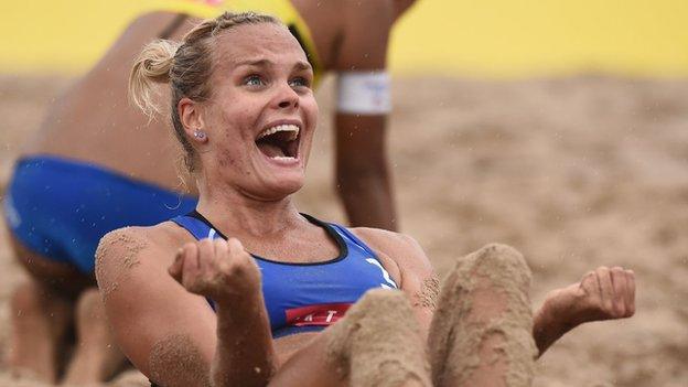 Tokyo, Japan, 28 July: Taru Lahti-Liukkonen of Finland celebrates her victory with Anniina Parkkinen in their FIVB Beach Volleyball World Tour match with Yui Nagata and Minori Kumada of Japan. (Photo by Matt Roberts/Getty Images)