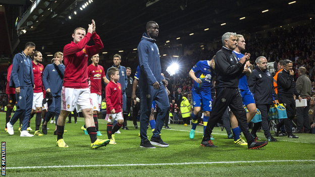 Wayne Rooney applauds fans as he leaves the pitch after his testimonial