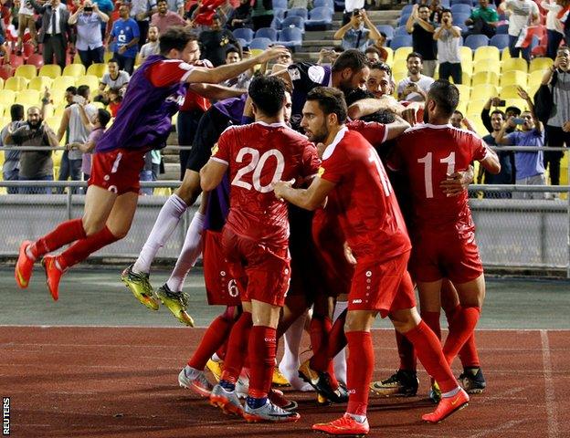 Syria players celebrate