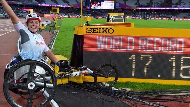 Cockroft celebrates next to the clock after setting new world record