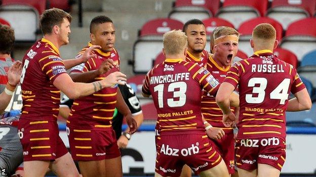 Huddersfield celebrate a try