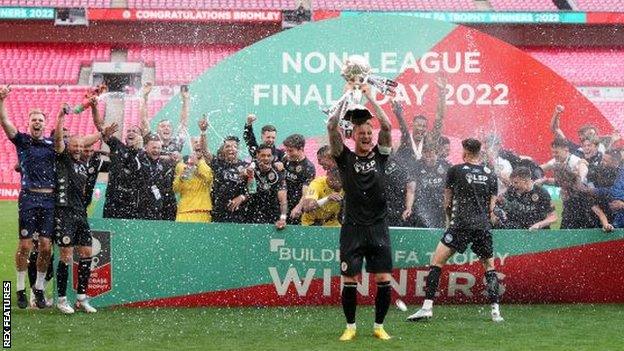 Bromley players lift the FA Trophy at Wembley