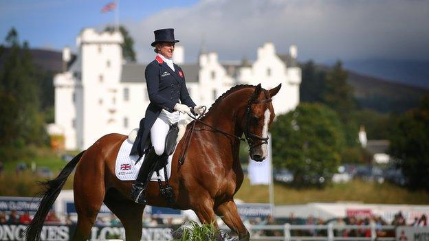 Equestrian rider on horse with Blair Castle in the background