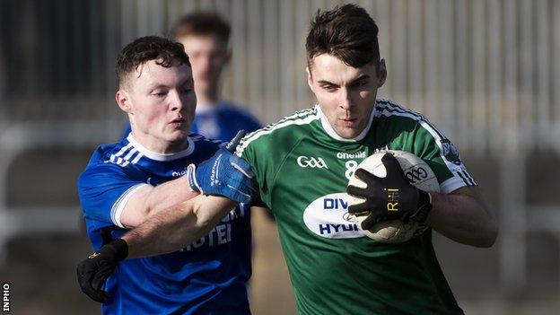 Naomh Conaill's Ultan Doherty challenges Gaoth Dobhair's Michael Carroll at Ballybofey