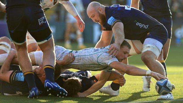 Northampton Saints Rory Hutchinson stretches to score a try