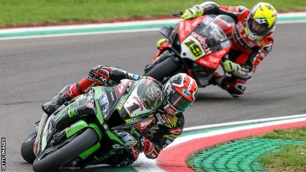 Jonathan Rea (left) battles with Alvaro Bautista at Imola in May