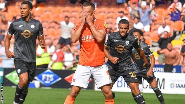 Jerry Yates reacts to his penalty miss