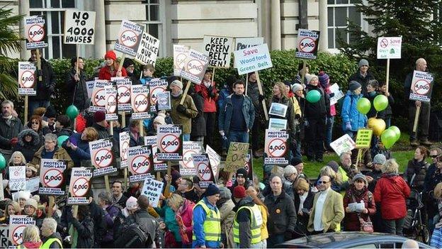 protesters march down road