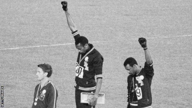 Tommie Smith (centre) and John Carlos make a black power salute on the podium at the 1968 Olympic Games