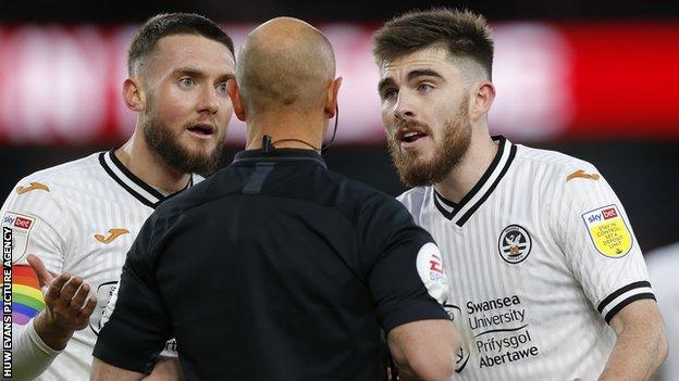 Swansea players protest