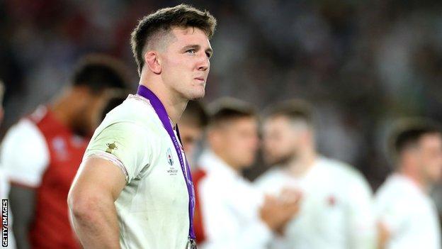 Tom Curry looks into the distance dejected after defeat in the Rugby World Cup Final