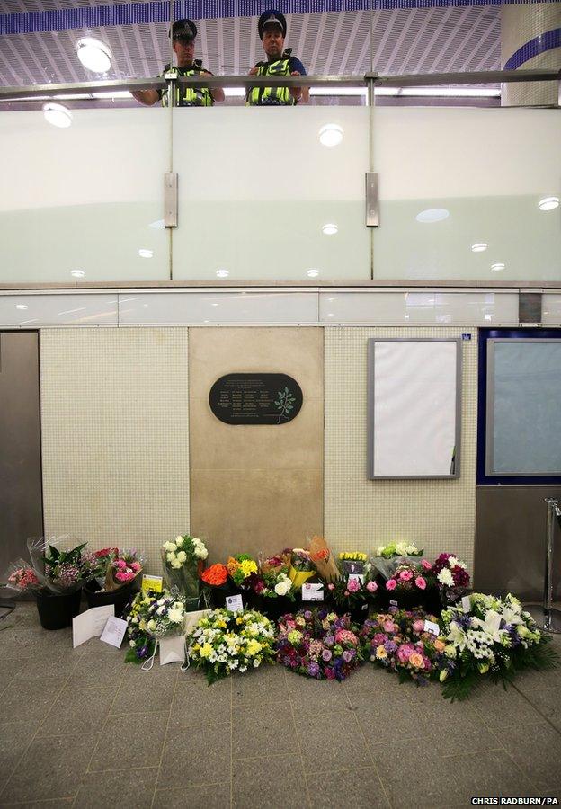 Floral tributes left at Kings Cross Underground station in London,