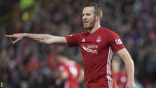 Adam Rooney makes a point for Aberdeen